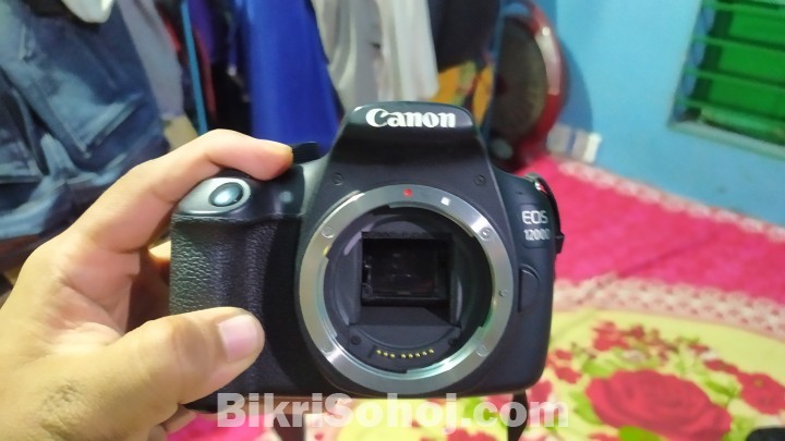Canon 1200D with 18-55mm kit lens. Full fresh condition